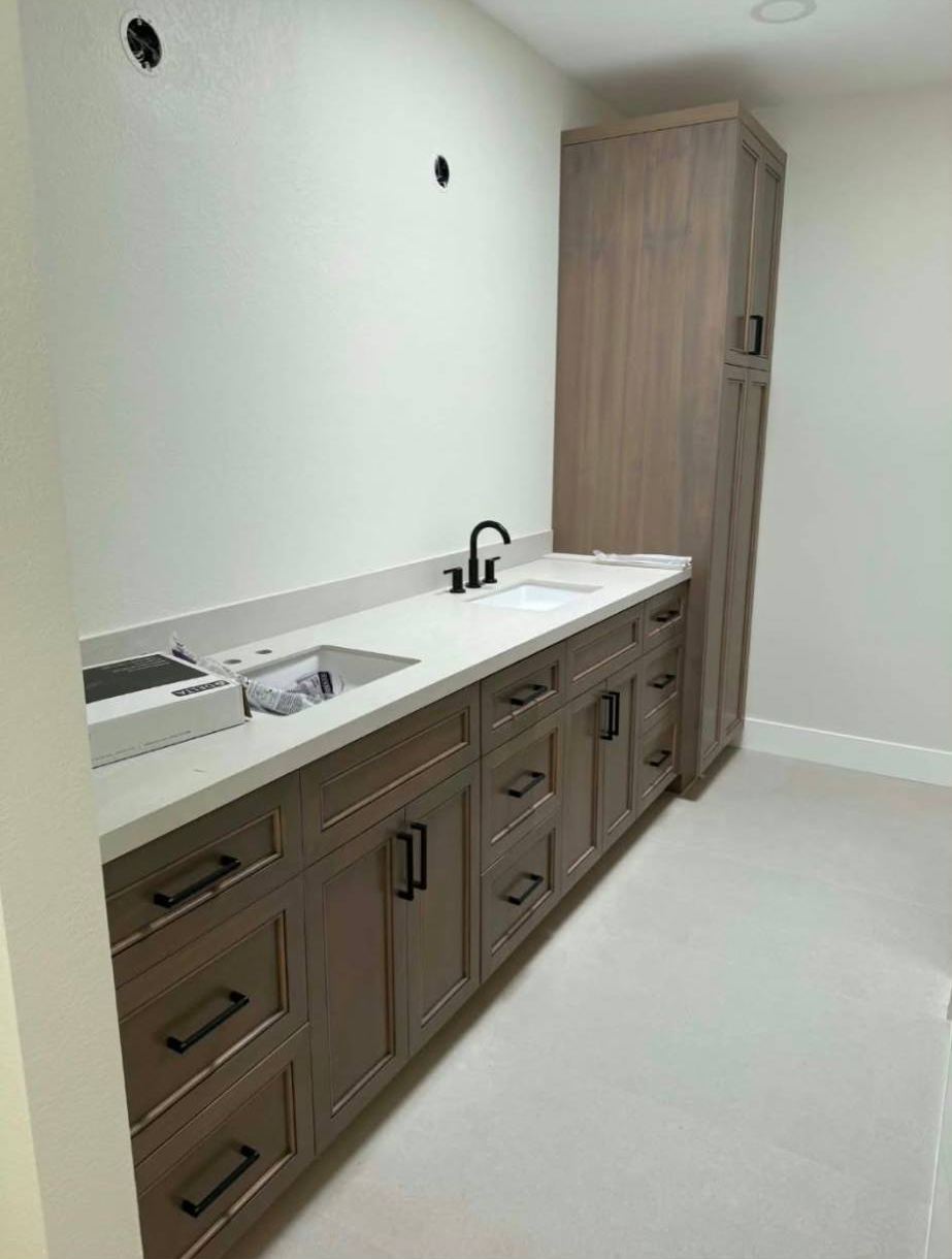 Double bathroom vanity with a matching linen tower